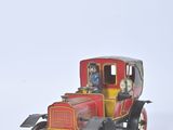a small toy car with two people sitting in it