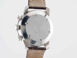 an image of a close up of a watch on a white surface