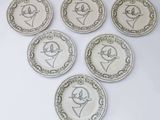 six assiettes ornées de dessins d'oiseaux sur un fond blanc