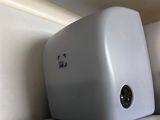 two toasters sitting on a shelf next to each other