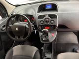 the interior of a small car with a steering wheel and dashboard controls