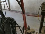 an image of a man working on a machine in a garage