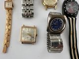 a lot of watches that are sitting on a table