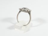 a close up of a ring on a white surface with a white background