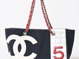 chanel black and white canvas tote bag with red chain handles