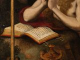 painting of a man sitting at a table with a book and a candle