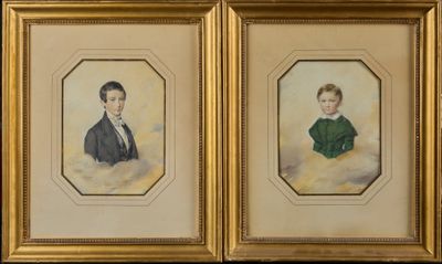 two framed portraits of a boy and a girl in a green dress