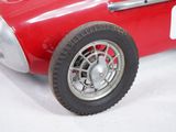 a red toy car with a number six on it