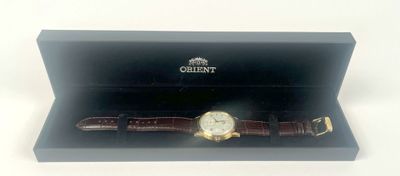 an image of a watch in a black box on a white surface