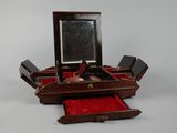 a small wooden box with a mirror in it
