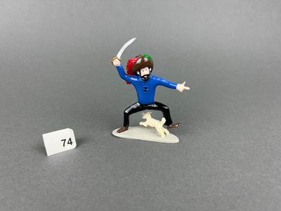 toy figurine of a man with a sword in his hand