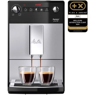 gros plan d'une machine à café avec deux tasses de café