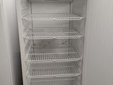 a white refrigerator with a door open in a kitchen