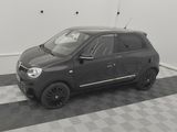 the small car is parked in the garage on the checkered floor