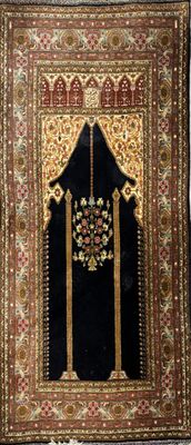 an oriental rug with a gold and black design on it