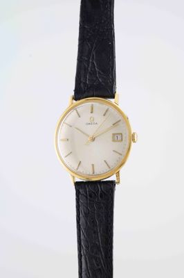 a close up of a watch on a black leather strap