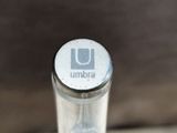 a close up of a bottle of water on a table