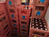 many crates stacked on top of each other in a room