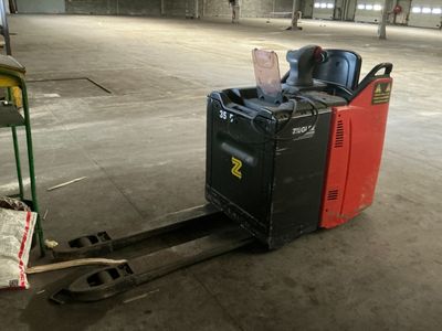 a forklift truck with a fork on it in a warehouse