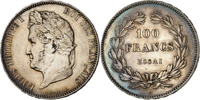 a silver coin with an image of a man ' s head on it