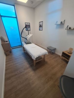an image of a room with a bed and a window