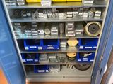 a metal cabinet with many different tools in it