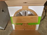 a cardboard box with a circular saw in it and a cardboard box with a circular saw in it