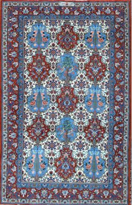 a red and blue rug with a floral design
