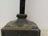a statue of a woman on a cross on a pedestal
