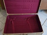 an open suitcase sitting on the floor on the floor