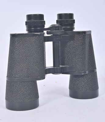 a close up of a pair of binoculars on a white surface