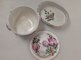two bowls and a bowl sitting on a table