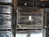 many cages that are stacked on top of each other