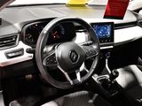 a steering wheel and dashboard of a car at a car show