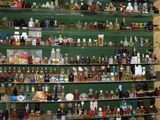 many bottles of liquor on the shelves in the room