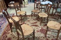 Suite de cinq CHAISES paillées en bois à dossier ajouré dit …