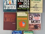 several books are stacked on top of each other on a table
