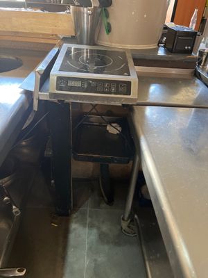 an image of a kitchen with a stove and a sink