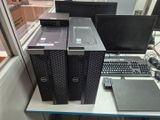 two computers and a keyboard on a desk