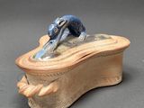 an image of a ceramic box with a dog on it