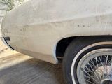 a white car that is parked on the side of the road