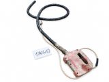 a small piece of metal with a cord attached to it