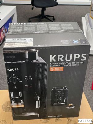 emballage d'une machine à café posée sur un carton