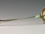 a silver spoon with a spoon handle on a table
