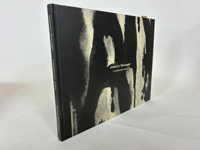 a black and white photo of a book on a white surface