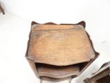 a small wooden table with a wooden tray on it