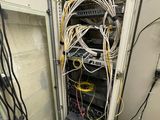 many wires and wires in a cabinet in a room