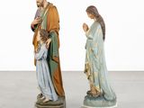 two figurines of jesus and a woman with a child