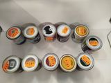 many cans of food that are sitting on a table