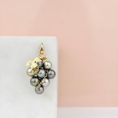 a close up of a white marble block with a bunch of pearls on it